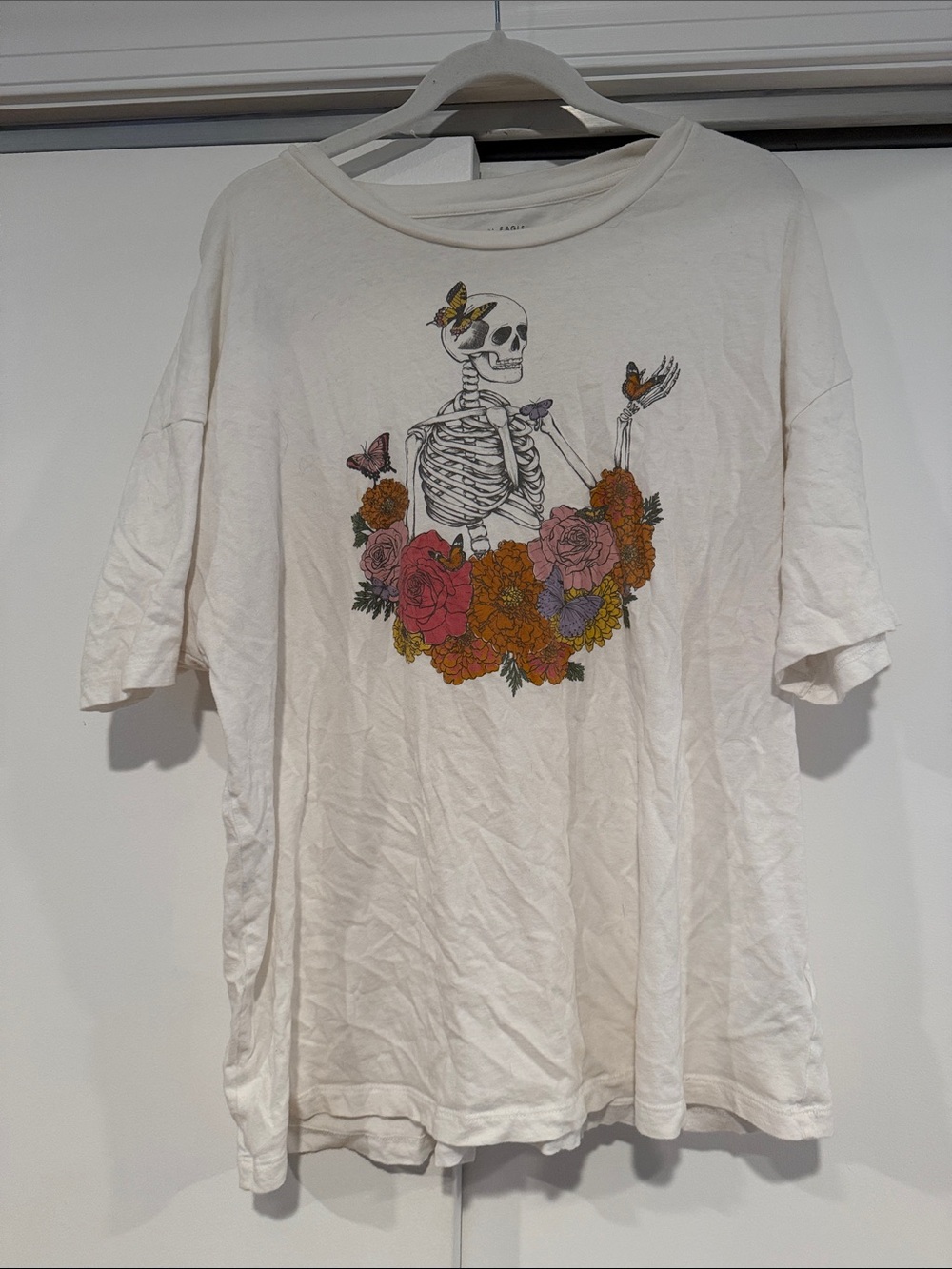 American Eagle Outfitters White Graphic Tee with Skeleton and Floral Print